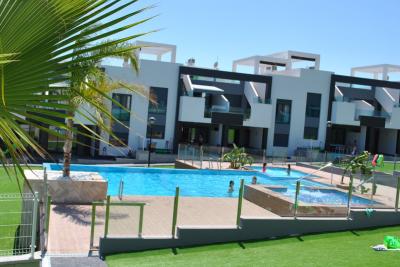 Bottenvåningslägenhet i Oasis Beach Punta Prima 8 Nº 039 in España Casas